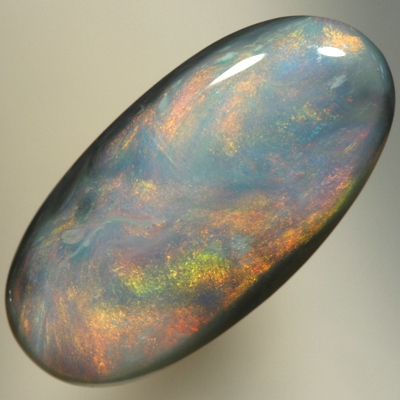 SOLID SEMI BLACK OPAL Glowing with a red Sheen pattern over blue
